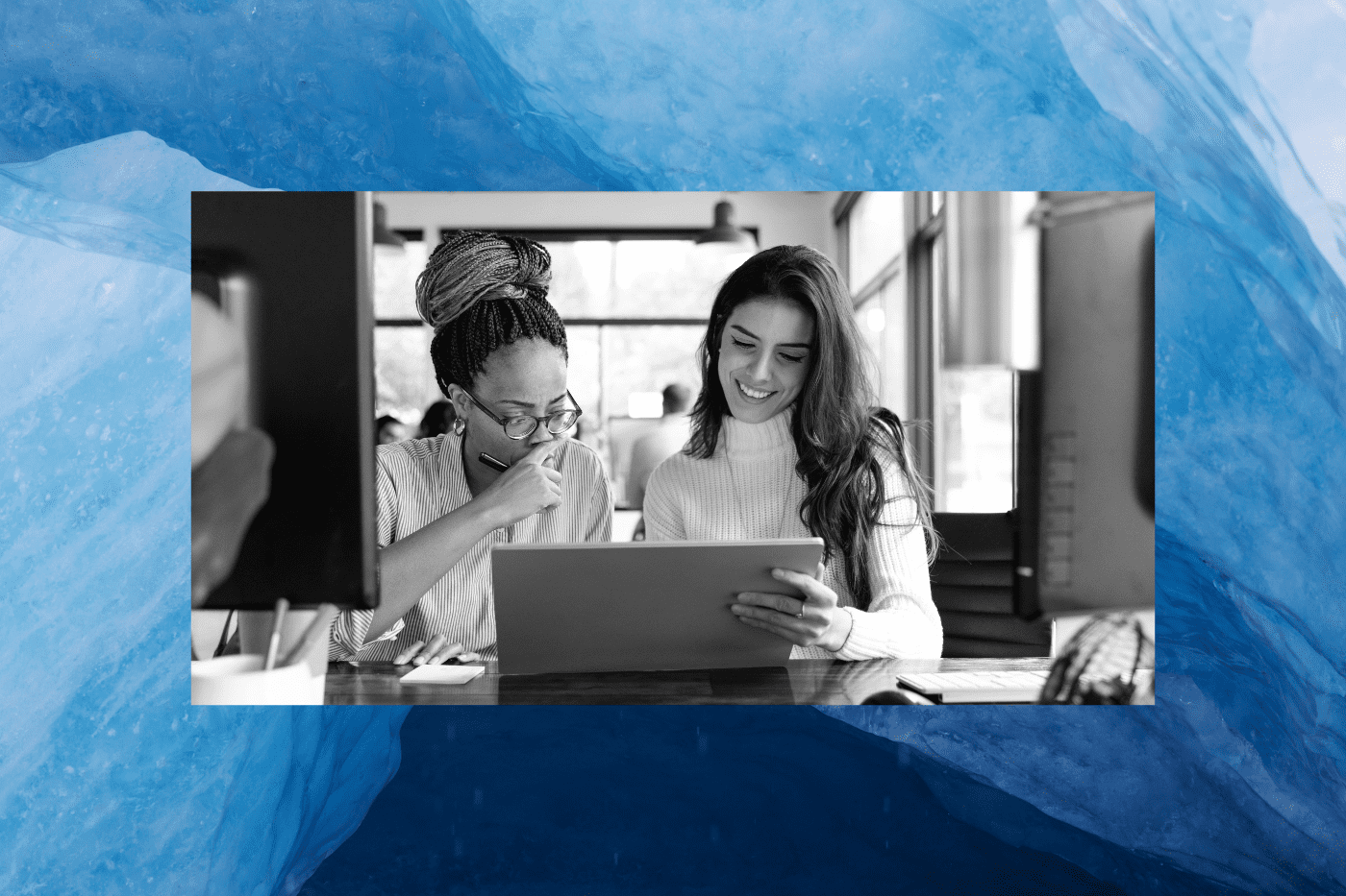 Two nonprofit employees reviewing their monthly giving program.